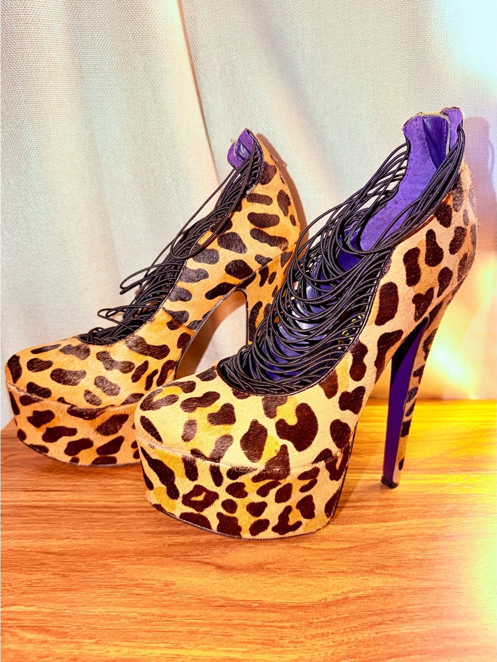 London Trash Leopard Platform Pumps with Black Lace and Purple Accents.